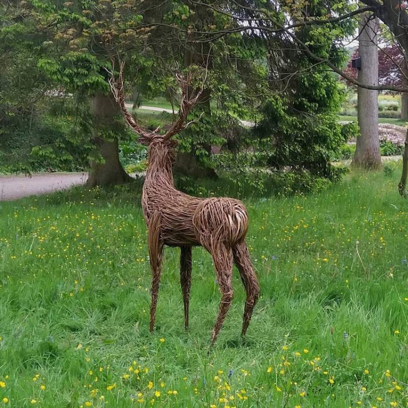 woven rods deer statue in UK forest